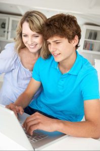 Mother and Teenage Son doing UCAS application to study at UK universities